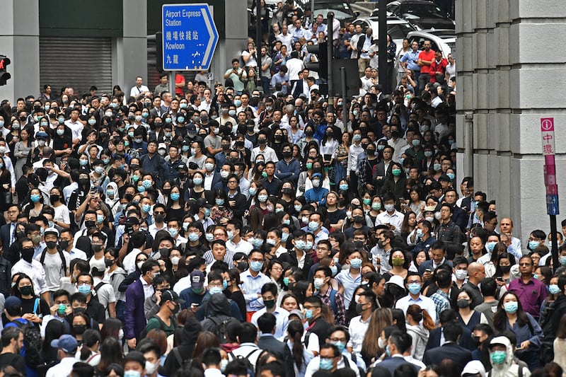 Office workers join pro-democracy protesters during a demonstration in Central in Hong Kong, Nov. 12, 2019 following a day of pro-democracy protests.