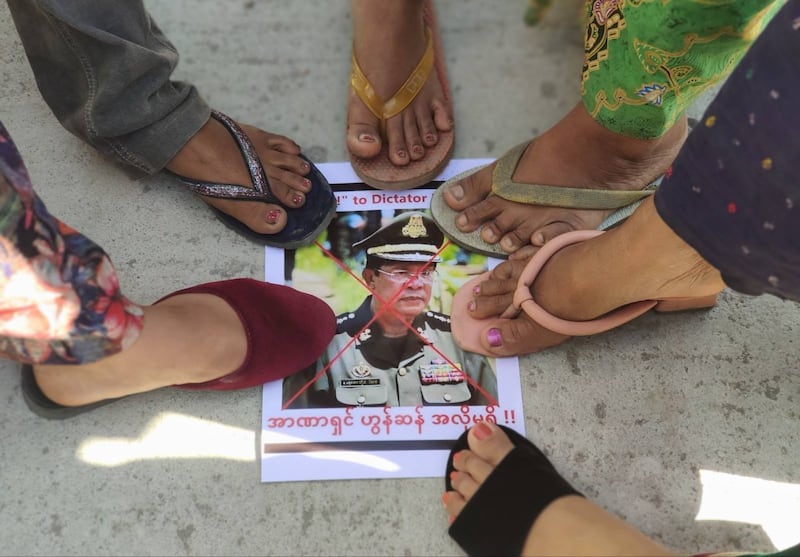 Residents step on a photo of Hun Sen during a protest in Sagaing's Kalay township, Jan. 6, 2022. RFA