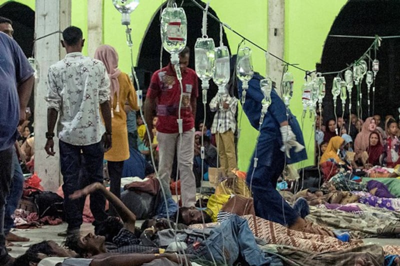 Rohingya refugees receive medical treatment at a temporary shelter in Pidie, Aceh province, Indonesia, Dec. 26, 2022. Credit: Antara Foto via Reuters