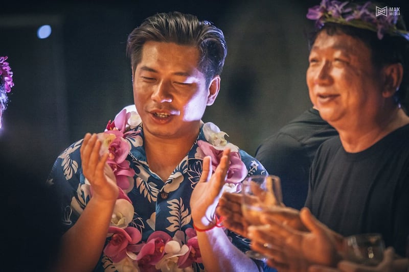 Rithy Samnang, left, and Xu Aimin have fun at the beach birthday party Samnang threw for himself on the island of Koh Smach. Credit: MAX Media