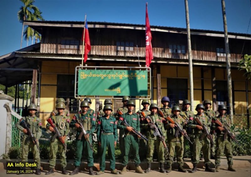 Arakan Army troops stand in front of the captured Paletwa Township General Administration Department office after seizing Paletwa, Jan. 14, 2024. (AA Info Desk)