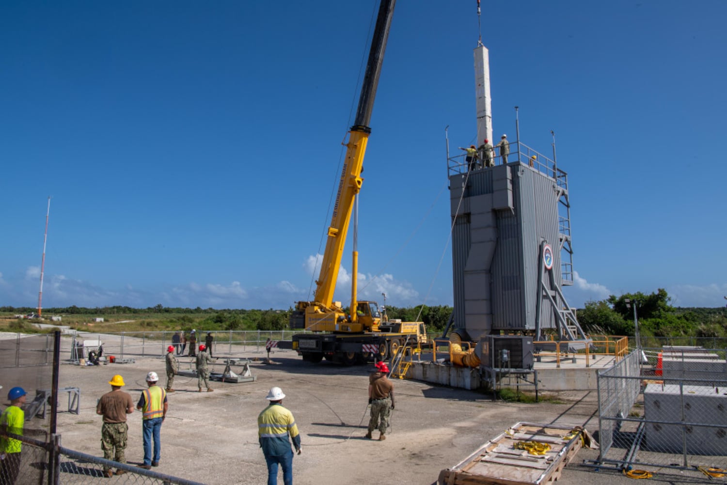 A missile is loaded into the Vertical Launching System at Andersen Air Force Base, Guam, in preparation for the ballistic missile exercise in this undated photo.