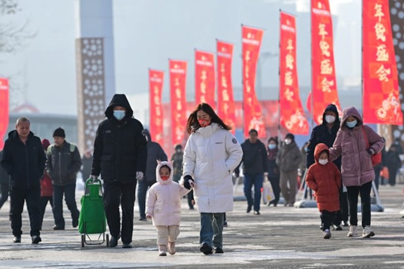 People visit a fair for the upcoming Lunar New Year in Urumqi, capital of northwest China's Xinjiang region, Jan. 27, 2024. (Ding Lei/Xinhua via Getty Images)