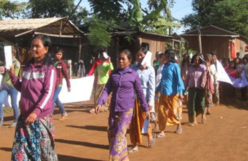 Indigenous villagers march to raise awareness of the negative impacts of hydropower dams in Stung Treng province, Dec. 9, 2014. Credit: RFA