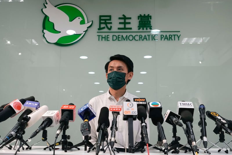 "All we wanted to do was eat together – it was just a meal," says Democratic Party chairman Lo Kin-hei, shown at a 2021 press conference in Hong Kong. Credit: Associated Press