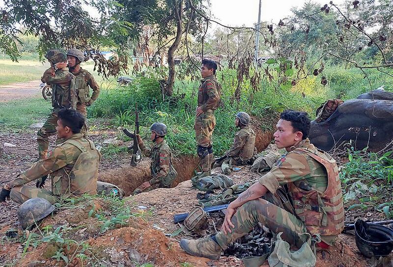 Members of the Ta'ang National Liberation Army (TNLA) gather inside a captured Myanmar military base in Hsipaw on Oct. 15, 2024.