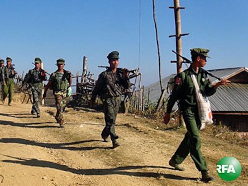 Soldiers from the Ta'ang National Liberation Army patrol a village in eastern Myanmar's Shan state in an undated photo.