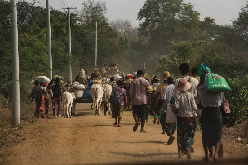 Residents flee Inn Sa in Sagaing region, Myanmar, after junta troops raided and burned nearly the whole village on April 21, 2023. Credit: Citizen journalist