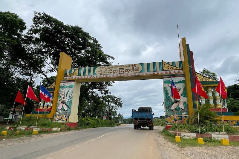 Myanmar National Democratic Alliance Army flags fly by the welcome archway to Lashio in Myanmar's northern Shan State, August 10, 2024.