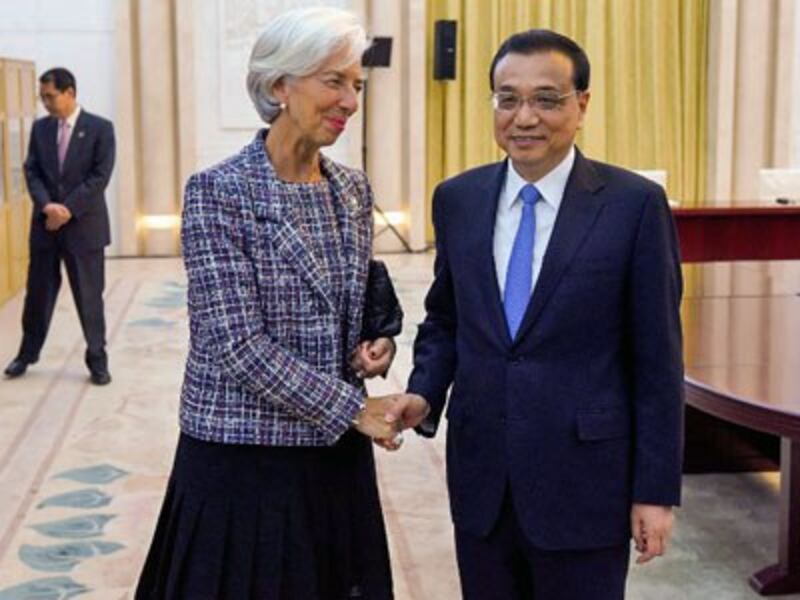 Christine Lagarde (L), managing director of the International Monetary Fund, greets Chinese Premier Li Keqiang (R) at the Belt and Road Forum in the Great Hall of the People in Beijing, May 14, 2017.