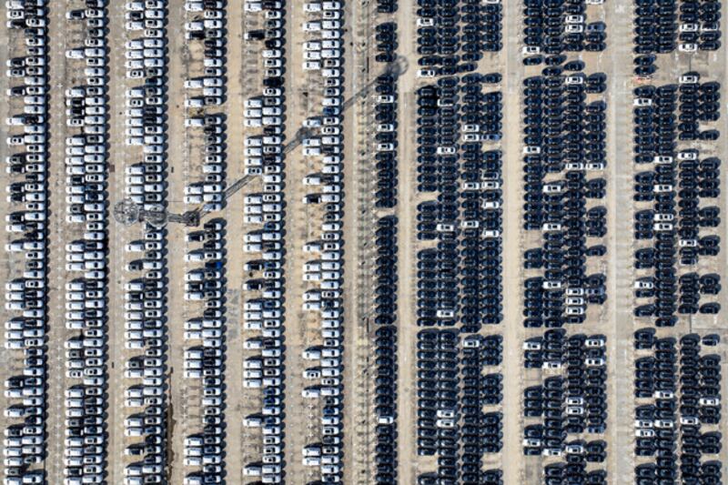 An aerial view of Volkswagen cars to be loaded onto a ship at a port in Nanjing, in eastern China's Jiangsu province, June 23, 2024. (AFP)