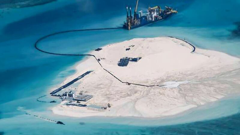 Close-up photo of Chinese dredging vessels operating around Mischief Reef in the South China Sea's disputed Spratly Islands in a U.S. Navy handout photo. 