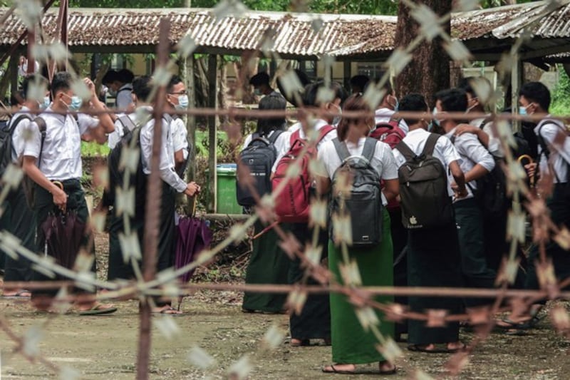 Students wait outside classrooms in Sittwe, capital of western Myanmar's Rakhine state, June 1, 2021. Credit: AFP