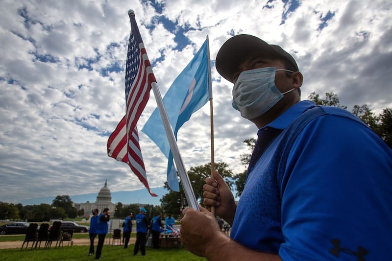 Karem Havib of Ellicott City, Maryland, participates in "Resist CCP: Global Day of Action" in front of the Capitol Reflecting Pool in Washington D.C., Oct. 1, 2020. Havib, who is a Uyghur, lost two of his cousins in Chinese prisons.  Photo: RFA/Leo Kim