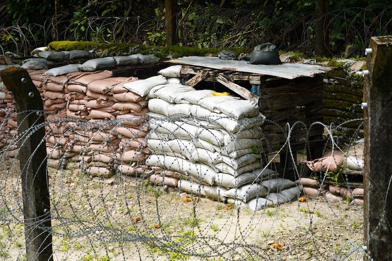 A Norwegian People’s Aid makeshift storage depot for unexploded ordnance is made up of sandbags, rotting wooden pallets and barbed wire in Peleliu, Palau, Nov. 26, 2024.