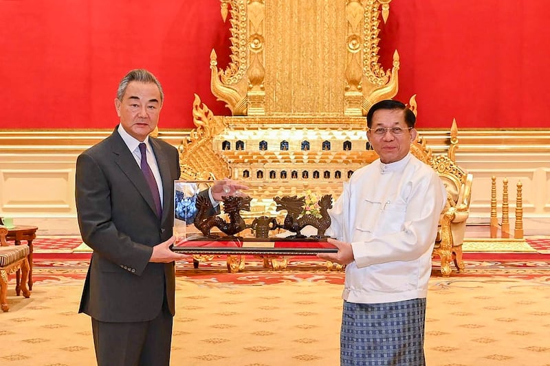 Myanmar's military chief Min Aung Hlaing (R) meets with China's Foreign Minister Wang Yi in Naypyidaw, Aug. 14, 2024. (Myanmar Military Information Team/AFP)