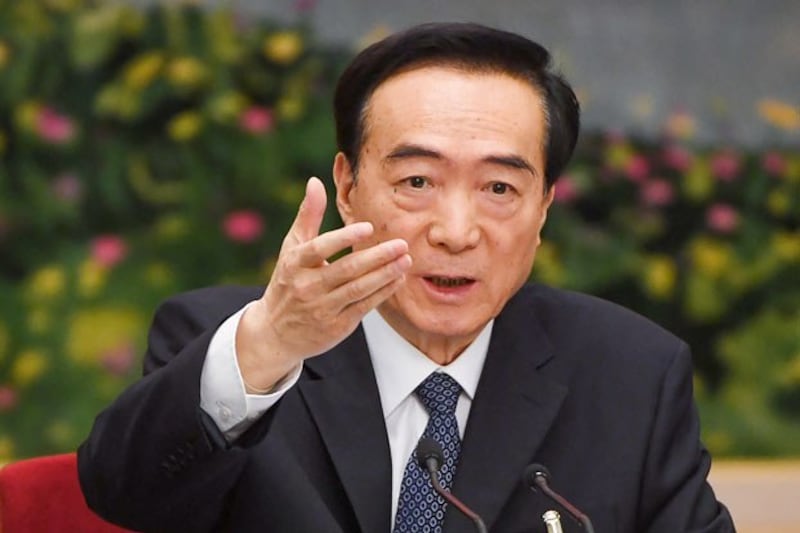 Chen Quanguo, Xinjiang's party secretary, speaks during a meeting of the Xinjiang delegation at the National People's Congress at the Great Hall of the People in Beijing, March 12, 2019. (Greg Baker/AFP)