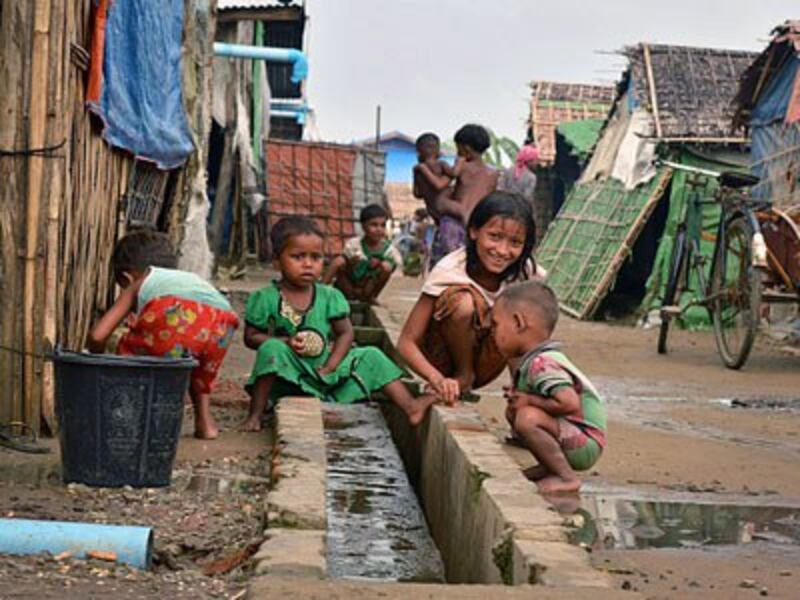 Rohingya children play inside an internally displaced persons camp during the Muslim holy month of Ramadan in Sittwe, western Myanmar's Rakhine State, July 2, 2016.