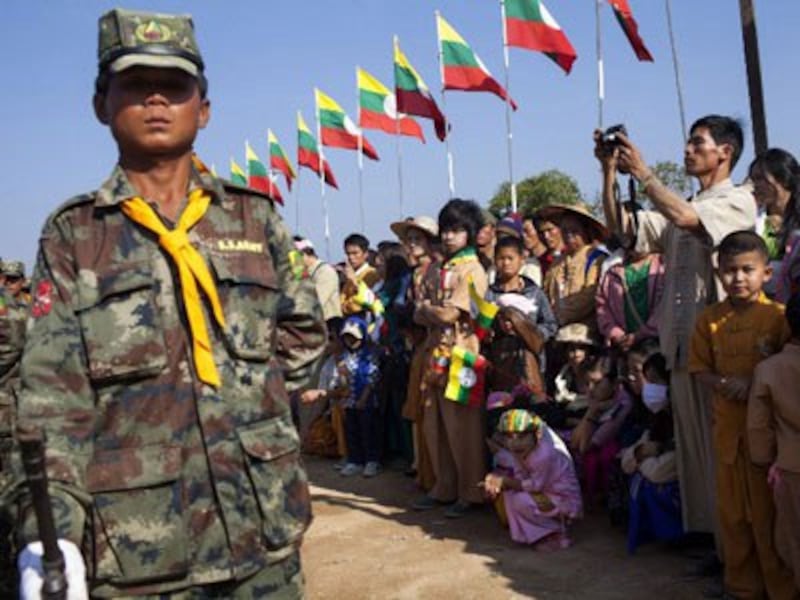 A crowd watches a military parade by the Shan State Army-South on Shan National Day in Loi Tai Leng in Myanmar's northeastern Shan state, Feb. 7, 2015.