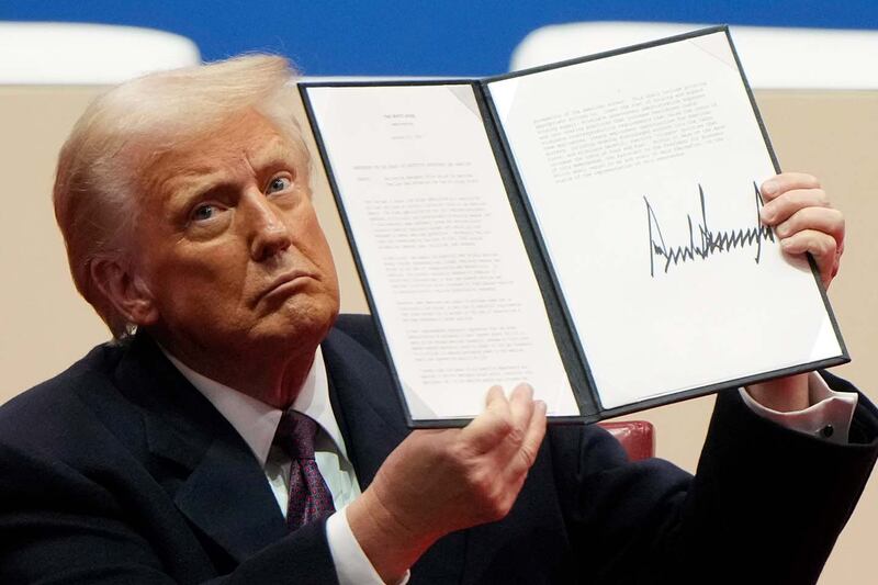 President Donald Trump holds executive order after signing in Washington, Jan. 20, 2025.