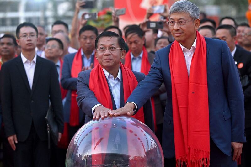 In this January 21, 2023 photo, Myanmar's junta chief Min Aung Hlaing, center and China's ambassador to Myanmar Chen Hai, right, take part in a ceremony on the eve of the Lunar New Year, in Yangon. Credit: AFP Photo