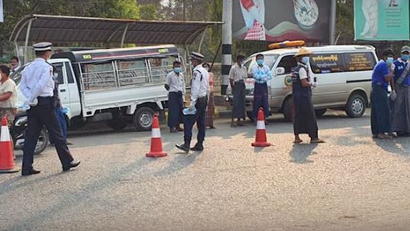 Police officers patrol a street amid a lockdown to prevent the spread of the coronavirus in northwest Myanmar's Sagaing region, April 2020.