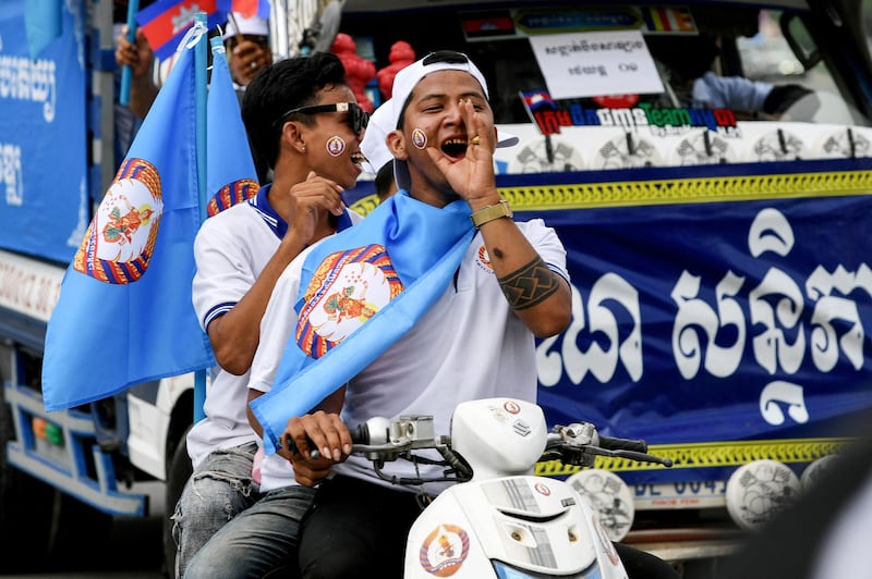 Supporters of the Cambodian People's Party shout slogans during a rally on the last day of campaigning for the 2022 commune elections in Phnom Penh. Credit: AFP