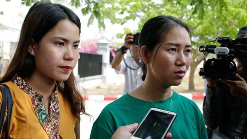 Chit Su Win (L), wife of Kyaw Soe Oo, and Pan Ei Mon (R), wife of Wa Lone, talk to the media after attending a hearing for their husbands at Myanmar's Supreme Court in Naypyidaw, April 23, 2019.