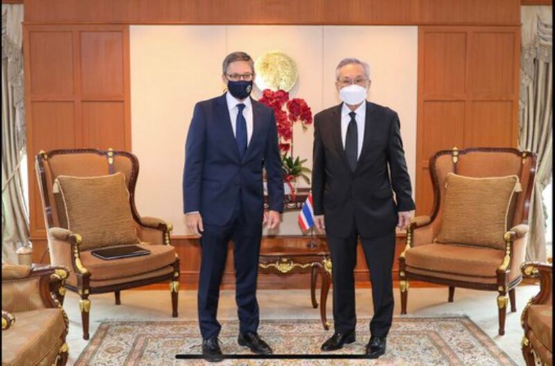 U.S. State Department Counselor Derek Chollet (L) stands with Thai Deputy Prime Minister and Minister of Foreign Affairs Don Pramudwinai, in Bangkok, Oct. 19, 2021. Credit: Thai Ministry of Foreign Affairs