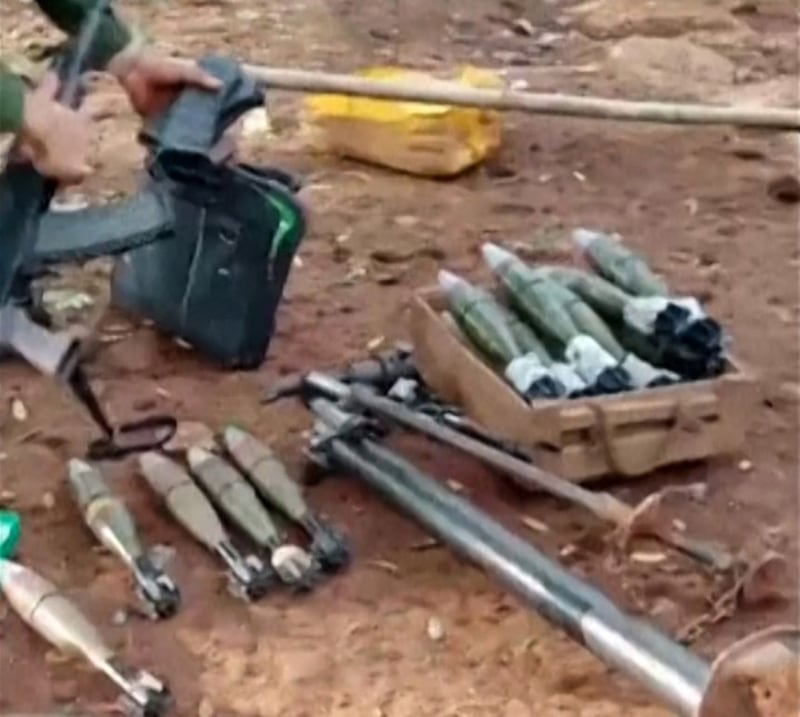 Myanmar National Democratic Alliance Army soldiers seized weapons and ammunition after taking control of a Myanmar military camp in Northern Shan state. Friday, Oct. 27, 2023. Credit: Screenshot from AFP video