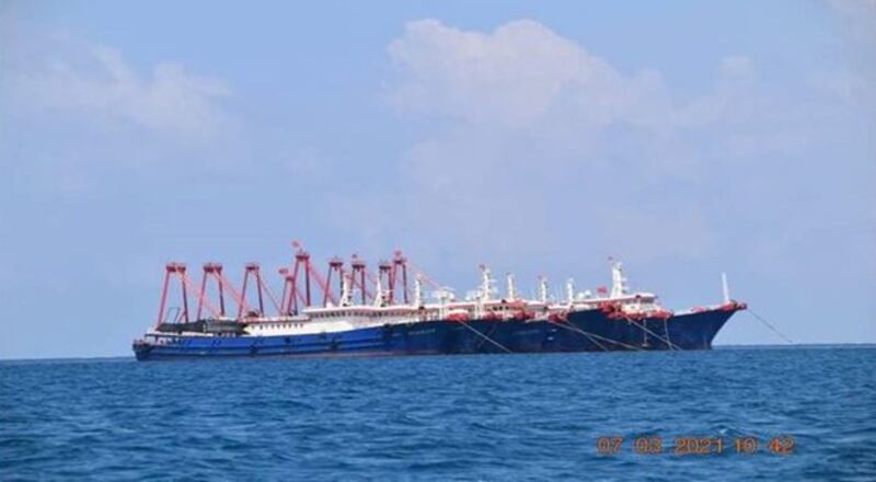 Some of the 220 Chinese vessels reported by the Philippine Coast Guard are pictured at the disputed Whitsun Reef, claimed by Manila, in the South China Sea, March 7, 2021. Credit: Reuters