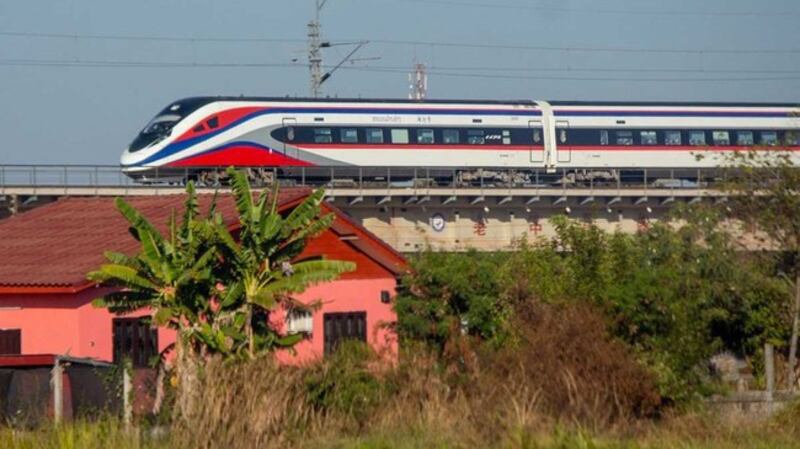 The Lao-China high-speed railway passes through a village outside the capital Vientiane, Dec. 3, 2021. Credit: RFA