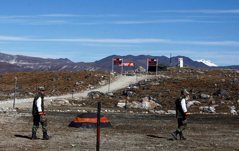 Indian army soldiers walk along the line of control at the India-China border in Bumla in Arunachal Pradesh, Oct. 21, 2012. (Anupam NathAP)