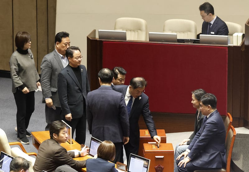 Lawmakers queue to cast their votes on the impeachment motion against President Yoon Suk Yeol at the National Assembly in Seoul, South Korea, Dec. 7, 2024.