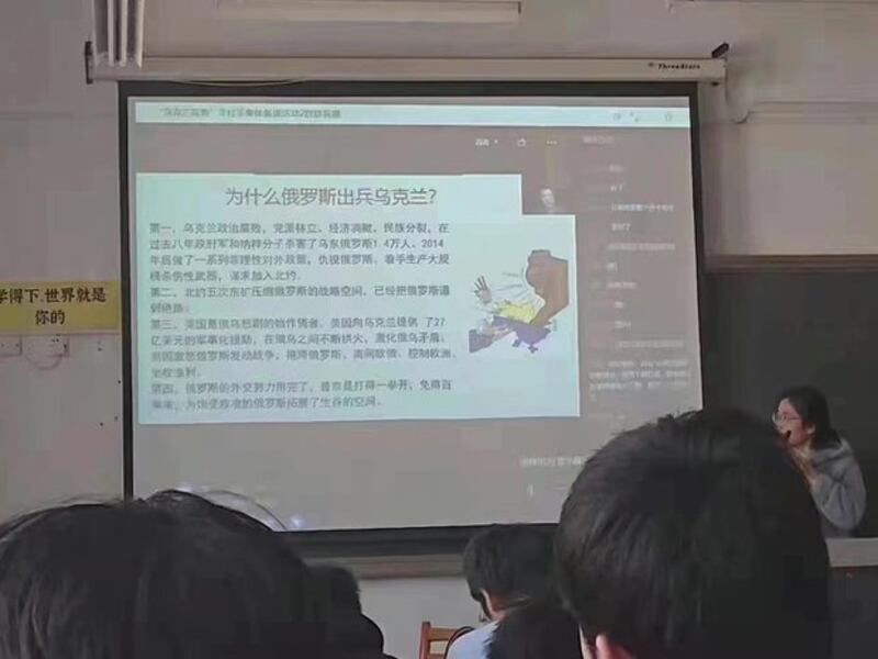 Students view a display showing the Chinese Communist Party's official line on the war in Ukraine being taught in schools in China. The lectures follow Russian and Chinese state media output on the war, which is being blamed on eastward expansion by NATO, rather than on the Russian decision to invade, and contains what critics say is significant disinformation. Credit: Chinese netizen.