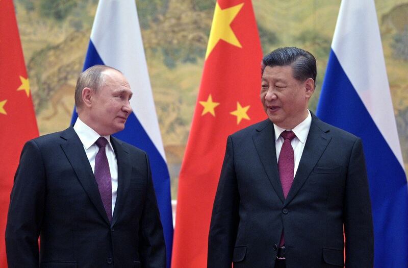 Russian President Vladimir Putin (L) and Chinese President Xi Jinping pose for a photograph during their meeting in Beijing, Feb. 4, 2022. Credit: AFP