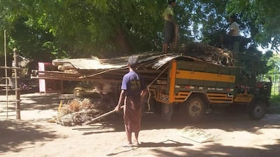 A villager packs construction materials from his home onto a truck after being evicted by the military in Mandalay region's Sintgu township, in an undated photo. Citizen journalist