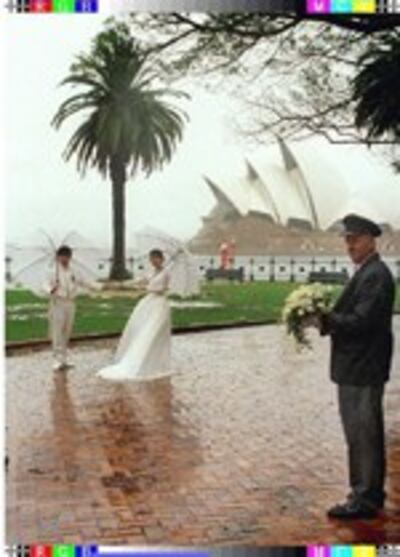 coupleWeddingRain150.jpg