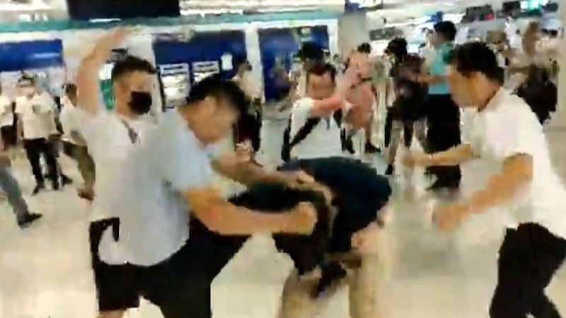 Screen grab taken from video showing a mob of men in white T-shirts attacking pro-democracy protesters at Yuen Long subway station in Hong Kong, July 21, 2019. Credit: RFA