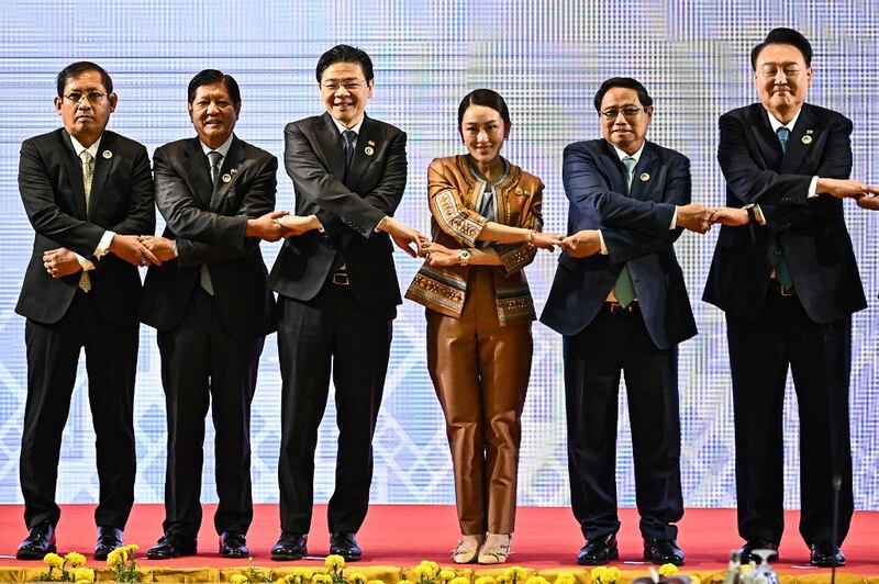 From left, Myanmar's Permanent Secretary of Foreign Affairs Aung Kyaw Moe, Philippines' President Ferdinand Marcos Jr, Singapore's Prime Minister Lawrence Wong, Thailand's Prime Minister Paetongtarn Shinawatra, Vietnam's Prime Minister Pham Minh Chinh, and South Korea's President Yoon Suk Yeol pose for a group photo at the 25th ASEAN-South Korea Summit during the 44th and 45th Association of Southeast Asian Nations (ASEAN) Summits in Vientiane, Oct. 10, 2024. (Nhac Nguyen/AFP)