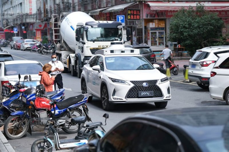 A Pony.ai robotaxi makes its way down the street in Nansha, China, in an undated photo. (Business Wire)