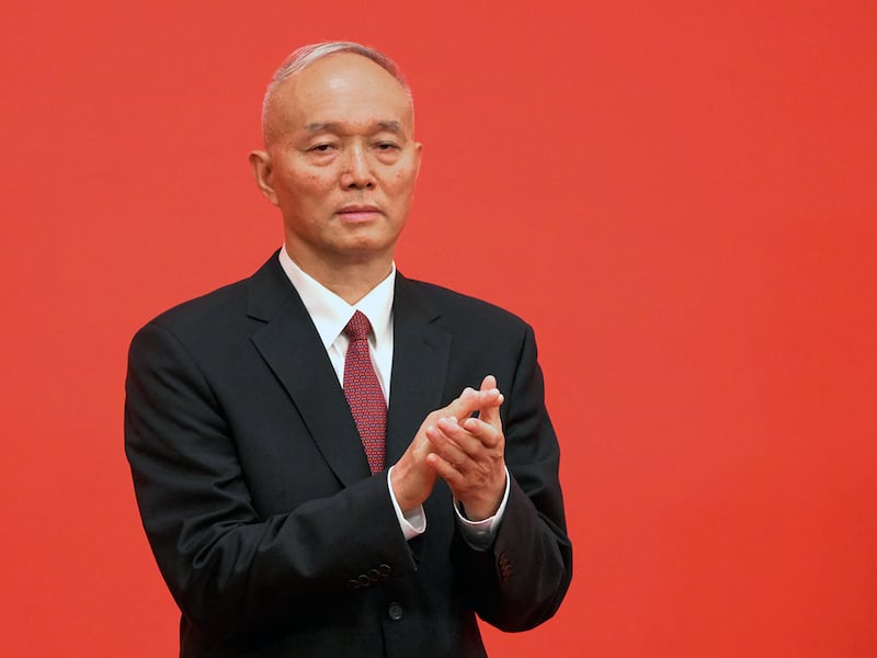 Cai Qi, Beijing Communist Party Secretary, applauds as he is introduced as a member of the Communist Party of China's Politburo Standing Committee, at the Great Hall of the People in Beijing, Oct. 23, 2022.