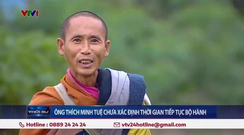 A screenshot from a Youtube video uploaded June 9, 2024 shows an interview aired by VTV with independent monk Thich Minh Tue, left, in which he said he agreed to stop walking the streets. (VTV24 via Youtube)