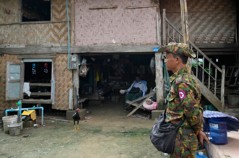 A soldier provides security while census enumerators collect information in Naypyitaw, Oct. 1, 2024. (Aung Shine Oo/AP)