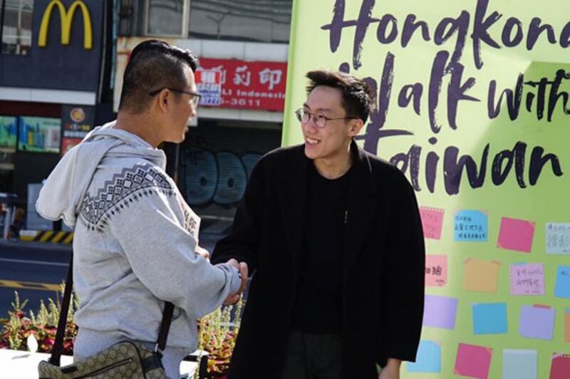 Hong Kong democracy activist Lo Tzu-wei (R) campaigns in democratic Taiwan, in an undated photo. (Courtesy of Lo Tzu-wei)