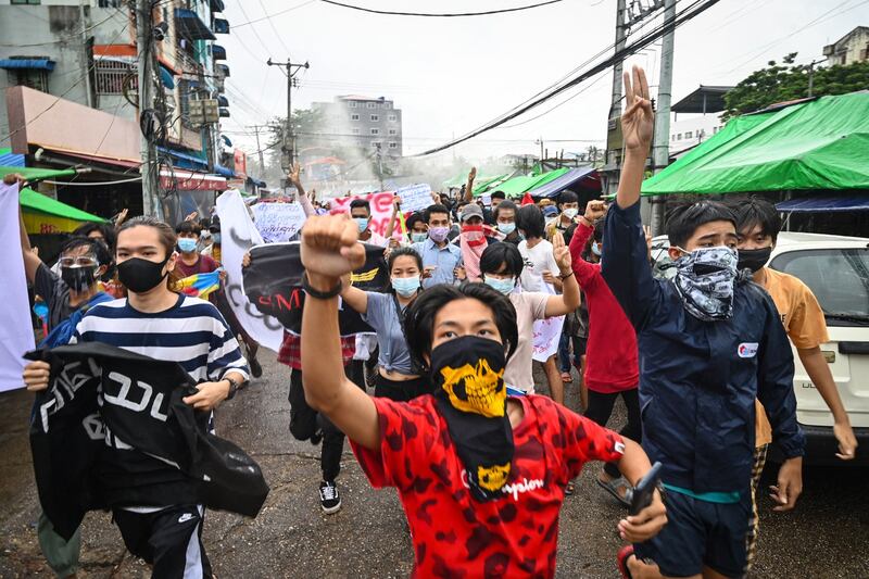 Protesters take part in a demonstration against the military coup and to mark the anniversary of 1962 student protests against the country's first junta in Yangon, July 7, 2021. AFP