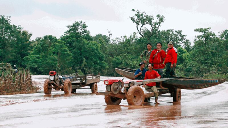 A boat is delivered to a flooded village in Sanamxay district, Attapeu province, in southern Laos, July 26, 2018. Credit: Associated Press