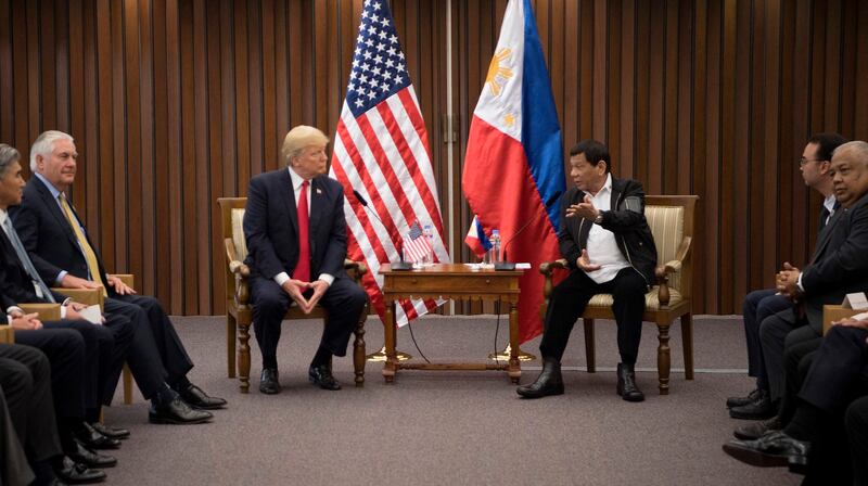 Then-U.S. President Donald Trump (center left) meets with then-Philippine President Rodrigo Duterte on the sidelines of the 31st ASEAN Summit in Manila, Nov. 13, 2017. (Jim Watson/AFP)