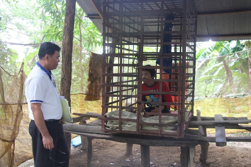 Chhim Sotheara meets with a patient in a rural area of Cambodia, in an undated photo. Credit: Chhim Sotheara