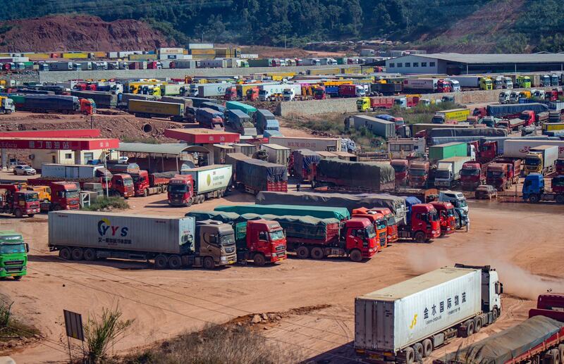 Lao and Chinese trucks wait to cross the Laos-China border at Boten-Mohan check point in Boten village in Luangnamtha province, Laos, Dec. 5, 2021.. Credit: RFA